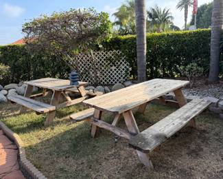 A pair of wood picnic tables 