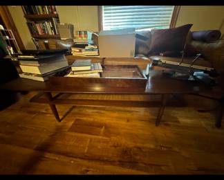 Walnut coffee table, books and accessories.