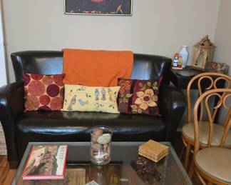 Glass coffee table 
Faux leather sofa