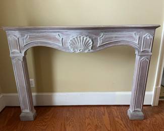 wooden mantle - 63 1/4 inches wide, 45 1/2 inches tall and 6 inches at its widest on top.