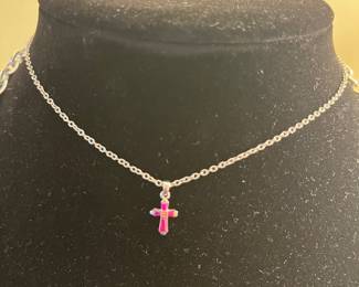 Childs ruby cross necklace.