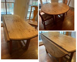 54 inch round drop leaf table. 24 inches wide when leafs are down.