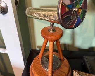 Brass kaleidoscope on wood stand 