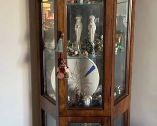 Wooden Corner Lit Curio Cabinet And Knick Knacks Within. Unknown Maker.