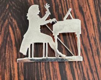 Lot#111 Now $48 - Was $65 Mexican silver pianist silhouette brooch 1 3/4"h weight:13.2 grams