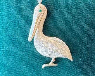 Lot#66 14k gold pelican pendant with emerald eyes