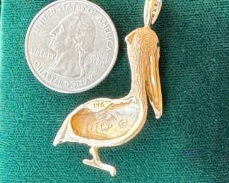 Lot#66 14k gold pelican pendant with emerald eyes