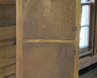 Wood closet with interior shelving. Image of it open to come on Friday.