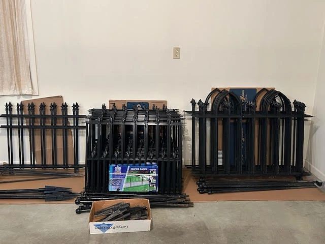 Black, heavy duty, powder coated metal fencing panels with poles/stakes.  Three different styles.