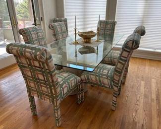 Tempered glass (1/2" thick) dining table with two faux stone pedestals: 84" x 42". Six upholstered Parsons chairs.