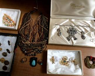 A little bit of jewelry: shown are old rhinestone sets, an enamel wreath by ART, turquoise rings and pendant piece, a delicate shell brooch, old Brownie and Girl Scout pins.