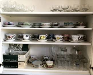 Lots of fancy teacups, old German wine glasses, bar ware.