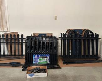 Black, heavy duty, powder coated metal fencing panels with poles/stakes.  Three different styles.