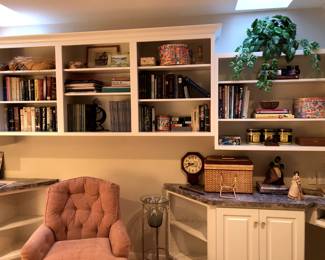 The library: books (fiction, biographies, nature), baskets, tins, standing glass vase, frames, decor....