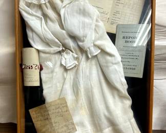 Vintage clothing in a shadow box