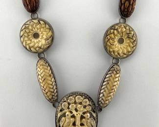 Sterling, carved bone and petrified wood necklace