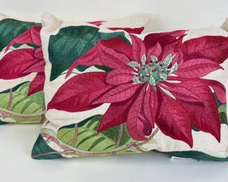 Two embroidered poinsettia pillows
