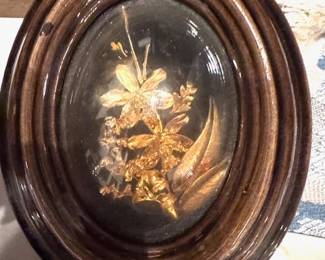 Small oval rounded glass floral arrangement