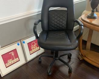 Office chair with adjustable height and swivels and artwork shown in photo
