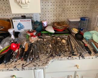Miscellaneous kitchen items, serving spoons and utensils