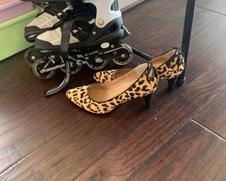 Children’s rollerblades and ladies shoes shown in photo