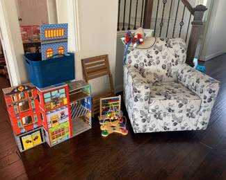 Upholstered chair that swivels and rocks, children’s Playhouse with accessories and education, educational toys shown in photo
