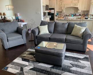 New Sofa with pillows, chair, ottoman and
Rug