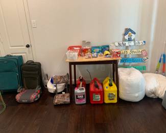 Luggage, gas cans, light bulbs, stadium seat, yard art and miscellaneous items shown in photo