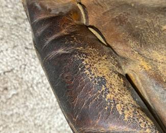 Old, vintage Mickey Mantel ball glove. Hard to read but it says “Major League” here. 