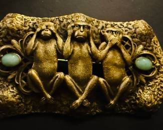 Antique see no evil hear no evil speak no evil brass sash pin set with green peaking glass. Ca, 1920.