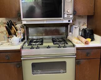 Avocado late 60's Magic Chef Range with top and bottom oven and built in overhead vent hood.  Still works!!!!