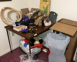 Sewing and crafting supplies.  Dress form appears to have been seldom used.