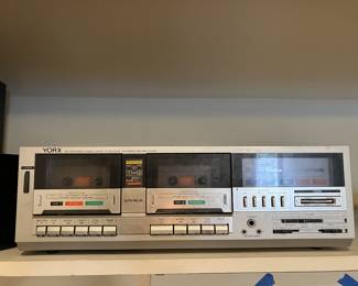 Vintage stereo with tuner, turntable, and dual cassette.