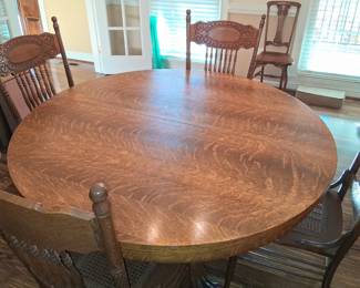 Dining table and chairs with extra leaves