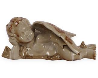 A Modern Glazed Ceramic Sleeping Cherub Figurine
