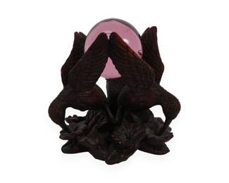 A SAN PACIFIC INTL (SPI) Carved Wooden Three-Bird Stand with Pink Glass Sphere
