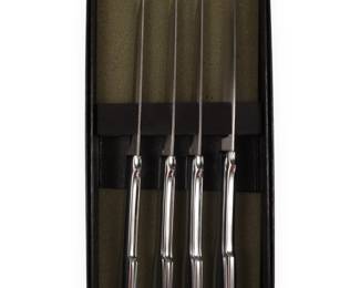 A Set of Four Modern Stainless Steel Steak Knives