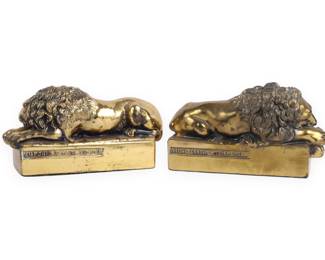 A Pair of Brass Sleeping Lion Bookends, after Antonio Canova