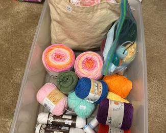 Crochet yarn and unfinished blanket in bag