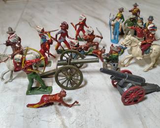 Vintage cast miniature cowboy and Indian figurines.