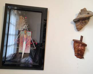 Art by David Grossjean (original mixed media) and artist made wood carvings.
