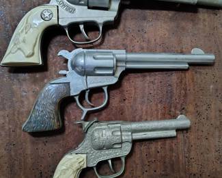 Very rare vintage cap guns. 
1. Hubley Cowboy cap gun 1960s.
2. Alan Ladd  cowboy gun by Geo Schmidt
3. Leslie Henry Wild Bill Hickok cap gun