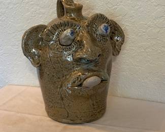 Assortment collectible face jugs