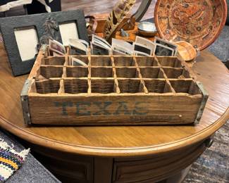 Vintage wooden beverage crate branded “TEXAS”