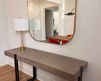 $580      "Concrete and Iron Console
Room: Dining Room
Dark iron base with gray concrete top.
67""W x 20""D x 30""H"	