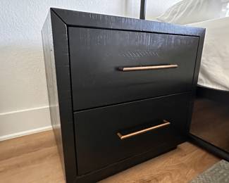 $230 each      "Black and Brass nightstand
Room: Master Bedroom
Acacia wood with burnished black finish. Brass hardware. (2)
Drawers
22""W x 18""D x 22""H"		