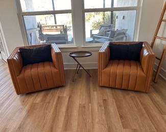 $1000 each      "Channeled Leather Swivel Chair
Room: Living Room
Tan top-grain leather with channeling
Swivel
32""W x 34""D x 26.5""H"	