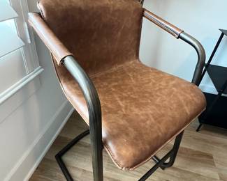 $120 each      "Faux Leather Counter Stool
Room: Kitchen
Faux leather upholstery with rubbed gold frame.
21""W x 21""D x 35""H"		
