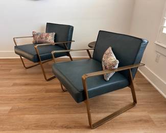 $850 each   Vintage peacock top grain leather with an exposed antique
brass steel frame.
26.5"W x 31"D x 27"H