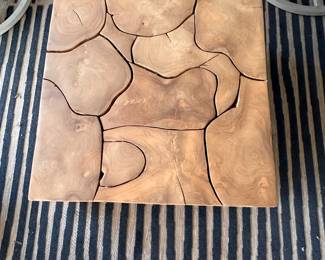 $400      "Outdoor Teak Root Table
Laminated Teak Root
Reflective or natural materials, tables will vary from piece to piece
30"" sq x 15""H"		